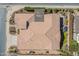 Aerial view of the property's layout with a shaded patio, turf area, desert landscaping, and the two-car garage at 706 E La Palta St, Queen Creek, AZ 85140