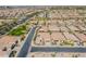 Real estate aerial view of the neighborhood showing parks, green spaces, streets, and proximity to amenities at 706 E La Palta St, Queen Creek, AZ 85140