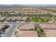 Real estate aerial view showing well-maintained neighborhood and proximity to green spaces, parks, and amenities at 706 E La Palta St, Queen Creek, AZ 85140