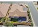 The backyard boasts an entertainment space, synthetic grass, well-manicured landscaping, and a covered patio at 706 E La Palta St, Queen Creek, AZ 85140