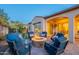 Cozy backyard fire pit with seating, offering a comfortable and inviting space for evening gatherings at 706 E La Palta St, Queen Creek, AZ 85140