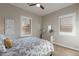 Inviting bedroom features plantation shutters, a ceiling fan, and a soothing color scheme for relaxation at 706 E La Palta St, Queen Creek, AZ 85140