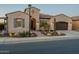 Charming single-story home featuring desert landscaping, a covered entryway, and an attached garage at 706 E La Palta St, Queen Creek, AZ 85140