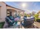 Outdoor fire pit with comfortable seating on the patio, perfect for outdoor gatherings and relaxation at 706 E La Palta St, Queen Creek, AZ 85140