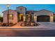Beautiful home exterior with desert landscaping, a paved walkway, and a welcoming entrance at 706 E La Palta St, Queen Creek, AZ 85140