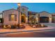 Charming home exterior with desert landscaping, a paved walkway, and a welcoming entrance at 706 E La Palta St, Queen Creek, AZ 85140