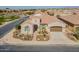 Stunning aerial view of a home with a well-manicured front yard, desert landscaping, and a spacious driveway at 706 E La Palta St, Queen Creek, AZ 85140