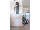 Garage featuring a central vacuum system, bicycles, and a refrigerator against a white wall at 706 E La Palta St, Queen Creek, AZ 85140