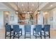 Modern kitchen with a large island and bar seating, perfect for entertaining and casual dining at 706 E La Palta St, Queen Creek, AZ 85140