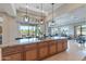 Bright, open kitchen with an expansive island perfect for gathering and entertaining at 706 E La Palta St, Queen Creek, AZ 85140