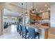 Spacious kitchen features a large marble island with barstool seating and stainless steel appliances at 706 E La Palta St, Queen Creek, AZ 85140