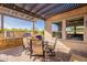 Outdoor kitchen and dining area, perfect for enjoying the outdoors and entertaining guests at 706 E La Palta St, Queen Creek, AZ 85140