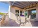 Inviting outdoor patio with a pergola, comfortable seating, and an adjacent built-in grill area at 706 E La Palta St, Queen Creek, AZ 85140