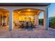 Outdoor patio with a dining set and comfortable seating, perfect for alfresco dining and entertaining at 706 E La Palta St, Queen Creek, AZ 85140