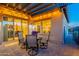 Enchanting covered patio with stylish seating and ambient lighting, ideal for relaxing evenings and gatherings at 706 E La Palta St, Queen Creek, AZ 85140