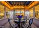 Cozy patio with stylish chairs, round table, and pergola, perfect for outdoor dining at 706 E La Palta St, Queen Creek, AZ 85140