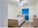 Bedroom with wood-look flooring and a bright blue window covering at 7807 S 350Th Ave, Tonopah, AZ 85354