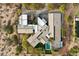 Aerial view of luxury home with a courtyard, desert landscaping, and pool at 8845 E Sierra Pinta Dr, Scottsdale, AZ 85255