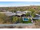 Aerial view of luxury home featuring a backyard pool, desert landscaping, and patio at 8845 E Sierra Pinta Dr, Scottsdale, AZ 85255