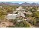 Aerial view of luxury home with mountain views and natural desert landscaping at 8845 E Sierra Pinta Dr, Scottsdale, AZ 85255