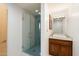 Modern bathroom featuring a glass-enclosed shower and vanity with vessel sink at 8845 E Sierra Pinta Dr, Scottsdale, AZ 85255