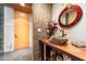 Bathroom features a unique stone vessel sink and a decorative round mirror at 8845 E Sierra Pinta Dr, Scottsdale, AZ 85255