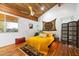 Cozy bedroom with wood ceilings, ceiling fan and natural light at 8845 E Sierra Pinta Dr, Scottsdale, AZ 85255