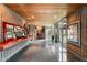 Spacious foyer with granite floors, wood-paneled ceilings, art display niches and walls of windows at 8845 E Sierra Pinta Dr, Scottsdale, AZ 85255