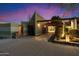 Inviting home entrance with a gated courtyard, desert landscaping and architectural accents at 8845 E Sierra Pinta Dr, Scottsdale, AZ 85255