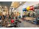 A gym with an extensive selection of weightlifting and exercise equipment and wall mirrors at 8845 E Sierra Pinta Dr, Scottsdale, AZ 85255