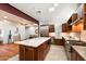 Bright kitchen with large island, stainless steel appliances, and open-concept design to the living room at 8845 E Sierra Pinta Dr, Scottsdale, AZ 85255