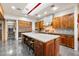 Gourmet kitchen features a large island, stainless steel appliances, and a stylish tile backsplash at 8845 E Sierra Pinta Dr, Scottsdale, AZ 85255