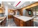 Open-concept kitchen with a large center island, and views of other living areas in the home at 8845 E Sierra Pinta Dr, Scottsdale, AZ 85255