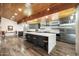 Gourmet kitchen with sleek cabinetry, an oversized island, and stainless steel appliances at 8845 E Sierra Pinta Dr, Scottsdale, AZ 85255