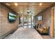 Unique living space with textured concrete walls, a wood ceiling, and views of the courtyard at 8845 E Sierra Pinta Dr, Scottsdale, AZ 85255
