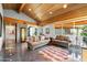 Spacious living room with high wood ceilings, large windows, and elegant furnishings at 8845 E Sierra Pinta Dr, Scottsdale, AZ 85255