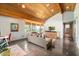 Inviting living room features wood ceilings, natural light, stylish furniture, and unique decor at 8845 E Sierra Pinta Dr, Scottsdale, AZ 85255