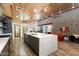 Bright open-concept living area showcasing a gourmet kitchen, unique wood ceiling, and designer touches throughout at 8845 E Sierra Pinta Dr, Scottsdale, AZ 85255
