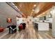 Bright open-concept living area showcasing a gourmet kitchen, unique wood ceiling, and designer touches throughout at 8845 E Sierra Pinta Dr, Scottsdale, AZ 85255