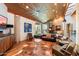 Spacious living room boasts wood floors, a fireplace, and plenty of natural light from the skylight at 8845 E Sierra Pinta Dr, Scottsdale, AZ 85255