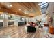 Bright open-concept living area showcasing a gourmet kitchen, unique wood ceiling, and designer touches throughout at 8845 E Sierra Pinta Dr, Scottsdale, AZ 85255