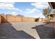 This expansive backyard offers a clean slate for outdoor living with privacy fencing and desert landscaping at 8962 W Grovers Ave, Peoria, AZ 85382