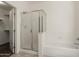 Bathroom features a glass enclosed shower and separate bathtub at 8962 W Grovers Ave, Peoria, AZ 85382