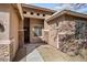 Inviting single-story home with a stylish mix of stucco and stone exterior accents, plus a covered front entrance at 8962 W Grovers Ave, Peoria, AZ 85382