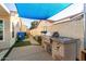 Outdoor kitchen area with a built-in grill and counter space at 950 W Cooley Dr, Gilbert, AZ 85233