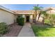 This home features a welcoming front porch and desert landscaping at 950 W Cooley Dr, Gilbert, AZ 85233