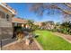 This lovely home features a lush lawn, desert landscaping, and charming curb appeal at 950 W Cooley Dr, Gilbert, AZ 85233