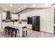 Modern kitchen with stainless steel appliances, backsplash, and a large island with seating at 950 W Cooley Dr, Gilbert, AZ 85233