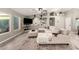 A large sectional sofa anchors this living room with hardwood floors and vaulted ceilings at 950 W Cooley Dr, Gilbert, AZ 85233