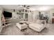 Open concept living room with wood floors, large sectional sofa, and neutral decor at 950 W Cooley Dr, Gilbert, AZ 85233